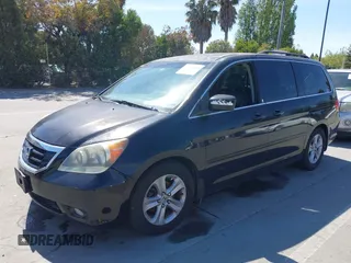 2008 Honda Odyssey Touring with VIN 5FNRL38948B116432, listed as a IAAI auction lot 42162566 with 121,996 mi miles. Bid and sale history available at carsss.com. Image 2.