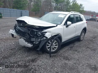 2014 Mazda CX-5 Sport with VIN JM3KE4BE3E0300849, listed as a IAAI auction lot 41942418 with 144,310 mi miles. Bid and sale history available at carsss.com. Image 17.