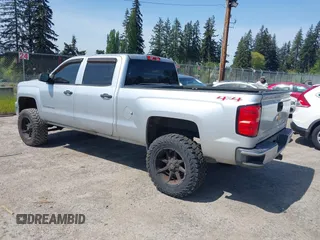 2014 Chevrolet Silverado 1500 LT with VIN 3GCUKREH0EG399090, listed as a IAAI auction lot 42142324 with 104,226 mi miles and . Bid and sale history available at DreamBid. Image 3.