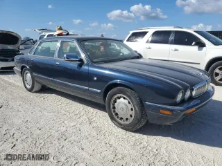 1999 Jaguar XJ with VIN SAJKX6049XC853940, listed as a Copart auction lot 74581244 with 0 mi miles and Salvage Title. Bid and sale history available at carsss.com. Image 4.