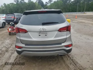2017 Hyundai Santa Fe 2.4L z VIN 5NMZT3LBXHH038022, wystawiony jako Copart lot #51060545 z przebiegiem 63 790 mil mil oraz Szkoda całkowita • Salvage title. Historia ofert i sprzedaży dostępna na DreamBid. Obrazek 6.