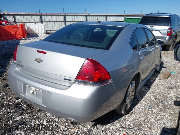 2014 Chevrolet Impala LT with VIN 2G1WB5E31E1184020, listed as a IAAI auction lot 41770355 with 135,367 mi miles and . Bid and sale history available at DreamBid. Image 4.