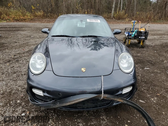 2007 Porsche 911 Turbo z VIN WP0AD29977S785458, wystawiony jako Copart lot #78957064 z przebiegiem 108 780 mil mil oraz Czysty tytuł • Clean title. Historia ofert i sprzedaży dostępna na DreamBid. Obrazek 5.