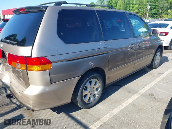 2004 Honda Odyssey EX-L with VIN 5FNRL18044B072819, listed as a IAAI auction lot 42441279 with 264,950 mi miles and . Bid and sale history available at DreamBid. Image 4.