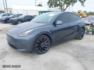 2021 Tesla Model Y Performance with VIN 5YJYGDEF4MF121690, listed as a IAAI auction lot 41385049 with 36,759 mi miles. Bid and sale history available at carsss.com. Image 2.