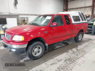 1999 Ford F-150 z VIN 1FTRX18WXXNA73861, wystawiony jako IAAI lot #42517576 z przebiegiem Nie podano mil oraz . Historia ofert i sprzedaży dostępna na DreamBid. Obrazek 2.