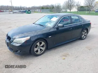 2007 BMW 5 Series 530i with VIN WBANE73597CM56897, listed as a IAAI auction lot 42113113 with 212,774 mi miles. Bid and sale history available at carsss.com. Image 2.