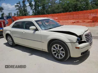 2009 Chrysler 300 Touring z VIN 2C3KA53V09H594340, wystawiony jako Copart lot #57789525 z przebiegiem 166 216 mil mil oraz Szkoda całkowita • Salvage title. Historia ofert i sprzedaży dostępna na DreamBid. Obrazek 4.