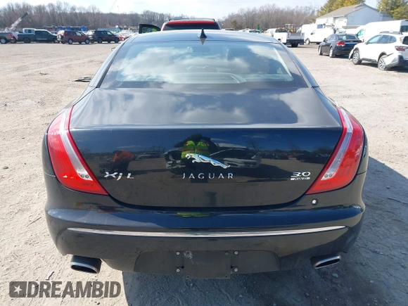 2013 Jaguar XJ Portfolio with VIN SAJWJ2GDXD8V55879, listed as a IAAI auction lot 41568366 with 121,119 mi miles and . Bid and sale history available at DreamBid. Image 16.