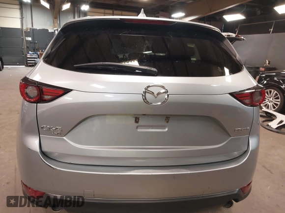 2021 Mazda CX-5 Grand Touring with VIN JM3KFBDM7M1392644, listed as a IAAI auction lot 41824612 with 80,000 mi miles and . Bid and sale history available at DreamBid. Image 15.