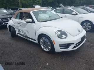 2017 Volkswagen Beetle S with VIN 3VW517AT1HM809338, listed as a IAAI auction lot 42461115 with 74,782 mi miles and . Bid and sale history available at DreamBid. Image 1.