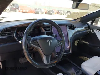 2020 Tesla Model S Long Range with VIN 5YJSA1E23LF381872, listed as a IAAI auction lot 41763046 with 96,720 mi miles and . Bid and sale history available at DreamBid. Image 23.