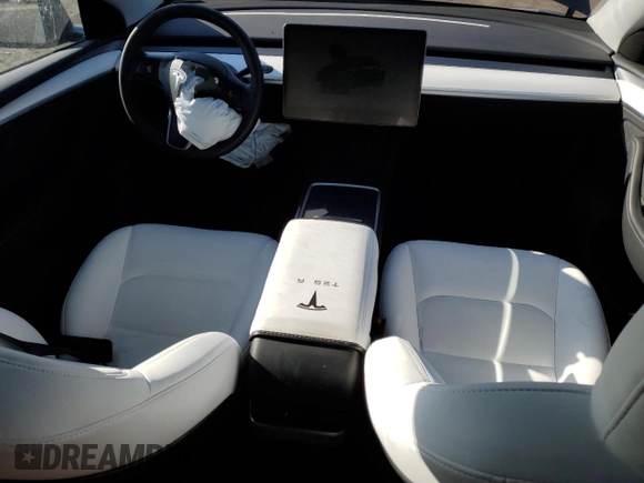 2023 Tesla Model Y Long Range z VIN 7SAYGDEE0PA206005, wystawiony jako Copart lot #50681145 z przebiegiem 31 989 mil mil oraz Szkoda całkowita • Salvage title. Historia ofert i sprzedaży dostępna na DreamBid. Obrazek 8.