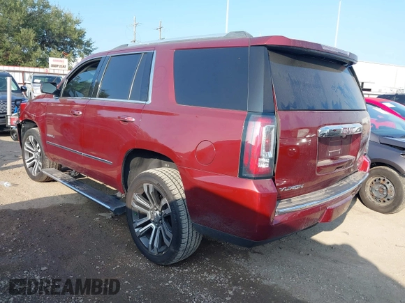 2017 GMC Yukon Denali with VIN 1GKS1CKJ4HR141145, listed as a IAAI auction lot 40799652 with 104,369 mi miles. Bid and sale history available at carsss.com. Image 3.