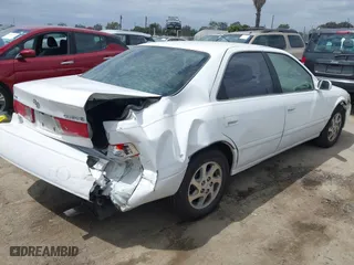 2000 Toyota Camry CE with VIN JT2BG22K3Y0406082, listed as a IAAI auction lot 42053116 with 171,219 mi miles. Bid and sale history available at carsss.com. Image 4.