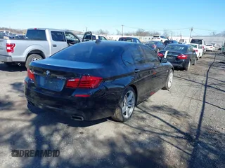2013 BMW 5 Series 550i xDrive with VIN WBAFU9C52DDY70807, listed as a IAAI auction lot 41902163 with 92,021 mi miles and . Bid and sale history available at carsss.com. Image 4.