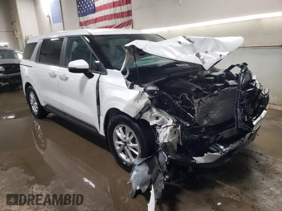 2023 Kia Carnival LX with VIN KNDNB4H39P6245635, listed as a Copart auction lot 77693694 with 26,752 mi miles and Salvage Title. Bid and sale history available at carsss.com. Image 4.
