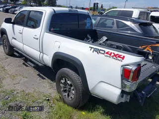 2021 Toyota Tacoma 4WD SR5 with VIN 3TMDZ5BN7MM103321, listed as a IAAI auction lot 41765512 with 49,009 mi miles. Bid and sale history available at carsss.com. Image 3.