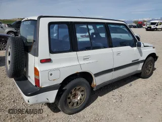 1995 Suzuki Sidekick z VIN JS3TD03V4S4113472, wystawiony jako Copart lot #51279074 z przebiegiem 199 736 mil mil oraz Tytuł czysty. Historia ofert i sprzedaży dostępna na DreamBid. Obrazek 3.