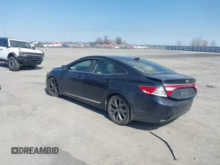 2013 Hyundai Azera with VIN KMHFH4JG6DA233205, listed as a IAAI auction lot 41643389 with 200,842 mi miles and . Bid and sale history available at carsss.com. Image 3.