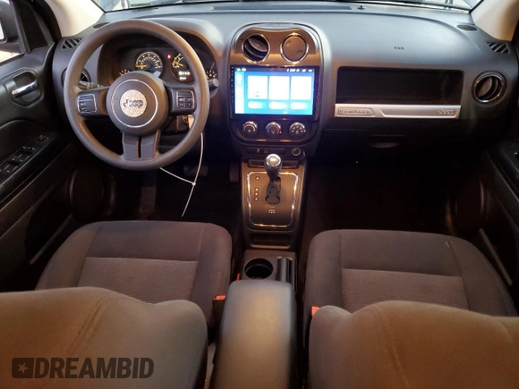 2016 Jeep Compass Sport with VIN 1C4NJCBB3GD574632, listed as a Copart auction lot 88016225 with 93,138 mi miles and Salvage title. Bid and sale history available at DreamBid. Image 8.