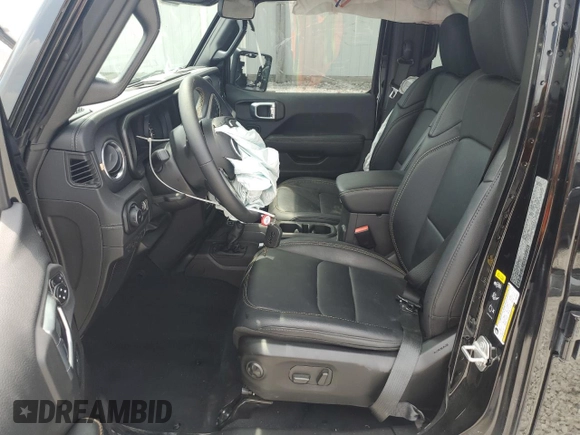 2024 Jeep Wrangler Sahara with VIN 1C4PJXEG0RW335831, listed as a Copart auction lot 61973055 with 15,785 mi miles and Salvage title. Bid and sale history available at DreamBid. Image 7.