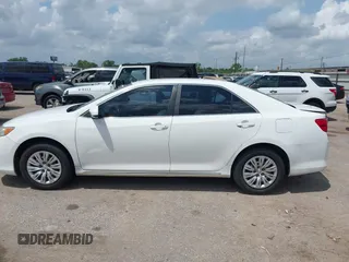 2014 Toyota Camry L with VIN 4T4BF1FK2ER375590, listed as a IAAI auction lot 42101553 with 126,849 mi miles and . Bid and sale history available at DreamBid. Image 14.