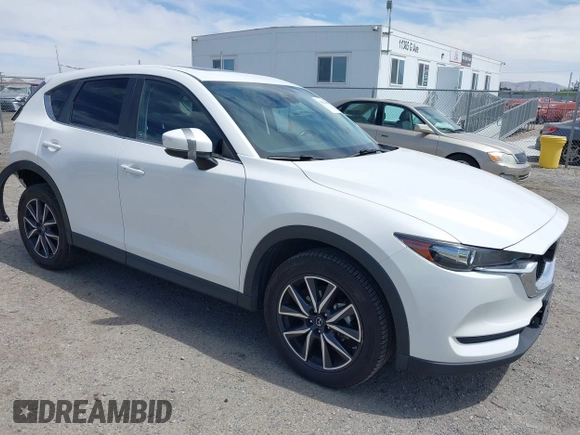 2018 Mazda CX-5 Touring with VIN JM3KFACM3J0381122, listed as a IAAI auction lot 42023838 with 76,121 mi miles. Bid and sale history available at carsss.com. Image 1.