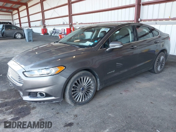 2013 Ford Fusion Titanium Hybrid with VIN 3FA6P0RU0DR277092, listed as a IAAI auction lot 41811079 with 123,071 mi miles. Bid and sale history available at carsss.com. Image 2.