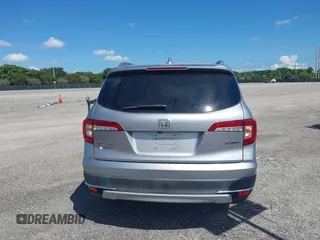 2021 Honda Pilot Touring 8-Passenger with VIN 5FNYF5H99MB041638, listed as a IAAI auction lot 42112915 with 33,230 mi miles and . Bid and sale history available at DreamBid. Image 16.