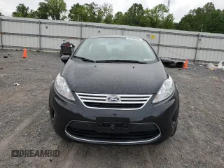 2012 Ford Fiesta SE z VIN 3FADP4BJ8CM152416, wystawiony jako Copart lot #57753335 z przebiegiem 25 293 mil mil oraz Szkody całkowita. Historia ofert i sprzedaży dostępna na DreamBid. Obrazek 5.