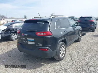 2015 Jeep Cherokee Latitude with VIN 1C4PJLCB3FW517843, listed as a IAAI auction lot 41828715 with 146,862 mi miles and . Bid and sale history available at DreamBid. Image 4.