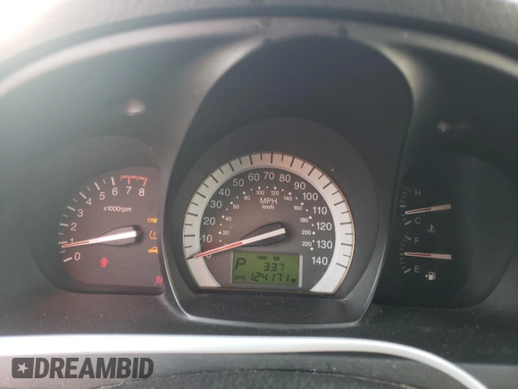 2009 Kia Spectra SX with VIN KNAFE221X95026213, listed as a Copart auction lot 85348104 with 124,171 mi miles and Salvage Title. Bid and sale history available at carsss.com. Image 9.