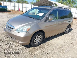 2006 Honda Odyssey EX-L with VIN 5FNRL38666B410188, listed as a IAAI auction lot 42004957 with 156,584 mi miles. Bid and sale history available at carsss.com. Image 2.