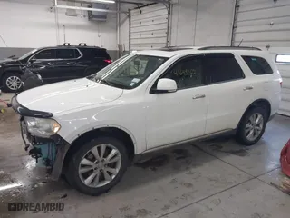 2013 Dodge Durango Crew with VIN 1C4SDJDT1DC540680, listed as a IAAI auction lot 41649262 with 106,016 mi miles. Bid and sale history available at carsss.com. Image 2.