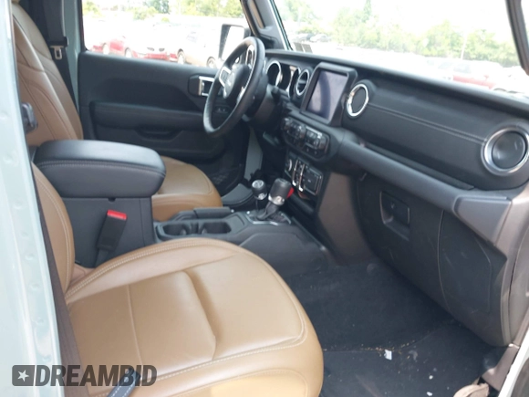 2023 Jeep Wrangler Sahara with VIN 1C4JJXP6XPW554741, listed as a IAAI auction lot 42380681 with 15,148 mi miles and . Bid and sale history available at DreamBid. Image 5.