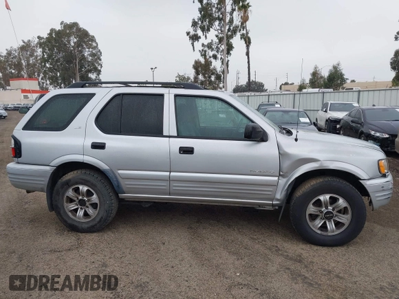 2001 Isuzu Rodeo S with VIN 4S2CK58W614361048, listed as a IAAI auction lot 41681566 with 133,460 mi miles and . Bid and sale history available at DreamBid. Image 13.