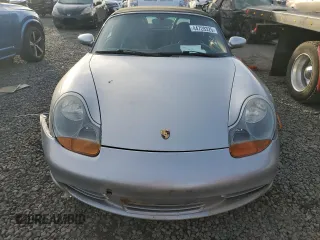 2000 Porsche Boxster z VIN WP0CA2980YU626179, wystawiony jako Copart lot #44728325 z przebiegiem 103 173 mil mil oraz Szkody całkowita. Historia ofert i sprzedaży dostępna na DreamBid. Obrazek 5.