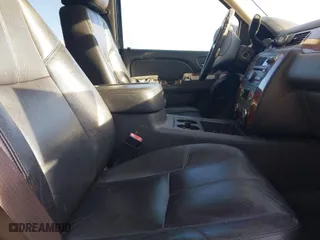 2013 Chevrolet Suburban LT with VIN 1GNSCJE03DR237220, listed as a IAAI auction lot 41904698 with 372,811 mi miles. Bid and sale history available at carsss.com. Image 5.