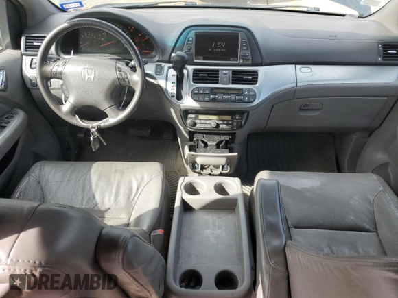 2010 Honda Odyssey EX-L with VIN 5FNRL3H72AB055070, listed as a Copart auction lot 80328974 with 221,467 mi miles and Salvage Title. Bid and sale history available at DreamBid. Image 8.