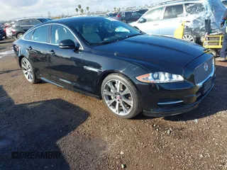 2015 Jaguar XJ with VIN SAJWA1CZ2F8V84677, listed as a IAAI auction lot 41723372 with 52,888 mi miles. Bid and sale history available at carsss.com. Image 1.