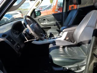 2005 Mercury Mariner Luxury z VIN 4M2CU57135DJ21208, wystawiony jako Copart lot #53555425 z przebiegiem 95 409 mil mil oraz Szkody całkowita. Historia ofert i sprzedaży dostępna na DreamBid. Obrazek 7.