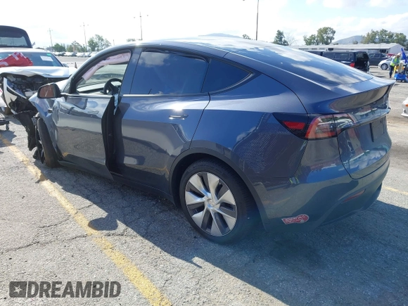2023 Tesla Model Y Long Range with VIN 7SAYGDEE7PA192488, listed as a IAAI auction lot 42233466 with Not provided miles and . Bid and sale history available at DreamBid. Image 3.