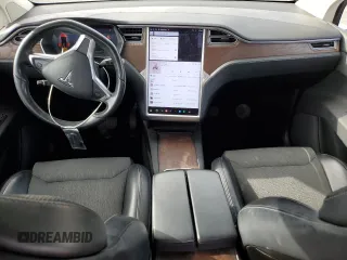 2016 Tesla Model X 70D with VIN 5YJXCAE28GF002399, listed as a Copart auction lot 50884225 with 73,113 mi miles and Salvage Title. Bid and sale history available at DreamBid. Image 8.