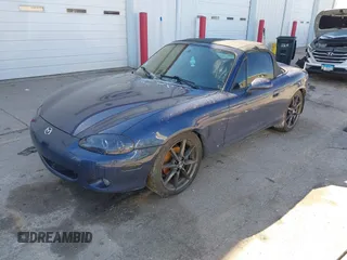 2002 Mazda MX-5 Miata Cloth z VIN JM1NB353920234533, wystawiony jako IAAI lot #41735487 z przebiegiem 112 661 mil mil oraz . Historia ofert i sprzedaży dostępna na DreamBid. Obrazek 2.