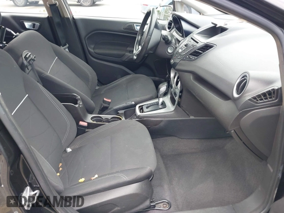 2014 Ford Fiesta SE z VIN 3FADP4BJ0EM216922, wystawiony jako IAAI lot #42255776 z przebiegiem 87 371 mil mil oraz . Historia ofert i sprzedaży dostępna na DreamBid. Obrazek 5.