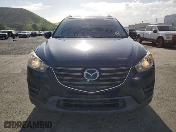 2016 Mazda CX-5 Sport with VIN JM3KE2BY0G0730906, listed as a Copart auction lot 51611865 with 207,166 mi miles and Salvage Title. Bid and sale history available at carsss.com. Image 5.