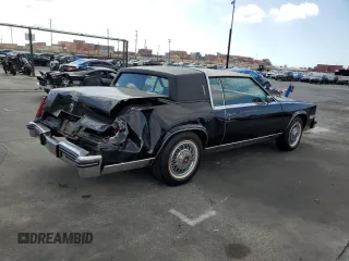 1985 Cadillac Eldorado z VIN 1G6EL578XFE640091, wystawiony jako Copart lot #71849374 z przebiegiem 30 631 mil mil oraz Szkody całkowita. Historia ofert i sprzedaży dostępna na DreamBid. Obrazek 3.
