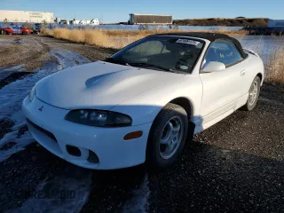 1999 Mitsubishi Eclipse GS with VIN 4A3AX35G2XE062629, listed as a Copart auction lot 87689125 with 223,210 mi miles and Salvage Title. Bid and sale history available at carsss.com. Image 2.
