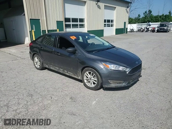 2018 Ford Focus SE z VIN 1FADP3F25JL257815, wystawiony jako Copart lot #61978045 z przebiegiem 62 328 mil mil oraz Szkoda całkowita • Salvage title. Historia ofert i sprzedaży dostępna na DreamBid. Obrazek 14.